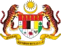 Shield showing the symbols of the Malaysian states with a star and crescent above and a motto below, supported by two tigers