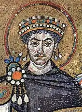 Mosaic of mustachioed, curly-haired man wearing crown and surrounded by halo