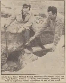 Black & white photograph of Rupert Bruce-Mitford and Paul Ashbee excavating at the Mawgan Porth Dark Age Village