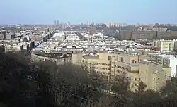 Overview of Inwood from Fort Tryon Park in 2018; in the right foreground is the Salome Urena de Henriquez Campus of the NYC Public Schools system; The Bronx is in the background