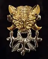 Catlike predator with protomas of two elk, burial mound Berel (IV.-III. BCE) Kazakhstan, Pazyryk culture.