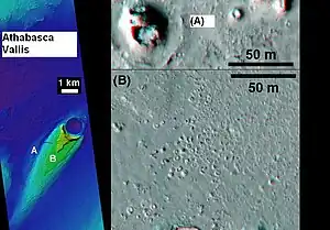 Cones in Athabasca Vallis, as seen by HiRISE. Cones were formed from lava interacting with ice. Larger cones in upper image were produced when water/steam forced its way through thicker layer of lava. Difference between highest elevation (red) to lowest (dark blue) is 170&nbsp;m (560&nbsp;ft).