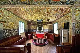 Altar, crucifix, baptismal font