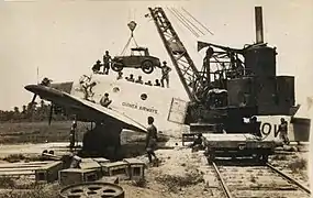 Loading the Austin 7 at Lae