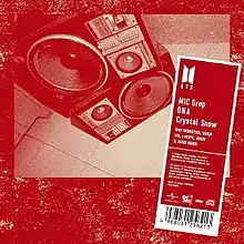 A stereo-system portrayed in red filter with "MIC Drop", "DNA", "Crystal Snow" written inside a vertical rectangle.