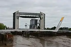 A large lifting structure, providing a tidal barrier over a river