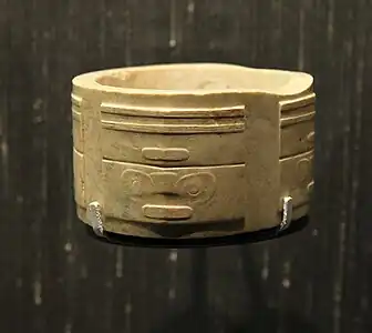 Highly stylized mascarons on a cong, produced by the Liangzhu culture, c.2500 BC, jade, British Museum, London