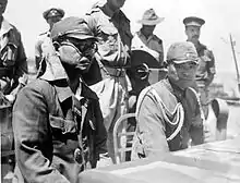 Kaida Tatsuichi, commander of the Japanese 4th Tank Regiment, and his chief of staff Shoji Minoru listen to the terms of surrender on HMAS&nbsp;Moresby at Timor.