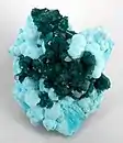 Dioptase on Chrysocolla,  Otjikotu,  Kunene Region, Namibia. 6.8 × 5.5 × 4.5&nbsp;cm