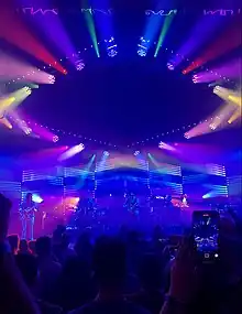 Goose performs under multi-colored lights.