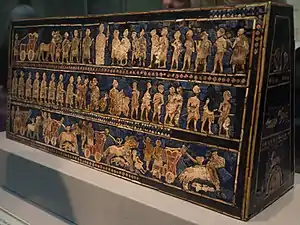 Standard of Ur; 2600–2400 BC; shell, red limestone and lapis lazuli on wood; length: 49.5&nbsp;cm; from the Royal Cemetery at Ur; British Museum