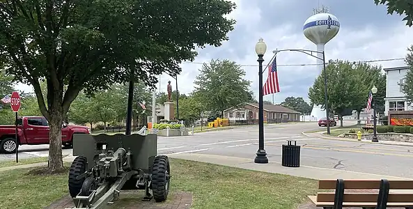 Public square with park, statue, Village Hall and Police Department