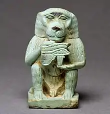 Amulet that depicts Thoth as a baboon holding the Eye of Horus; 664–332&nbsp;BC; Egyptian faience with light green glaze; height: 3.9&nbsp;cm, width: 2.4&nbsp;cm, depth: 2.5&nbsp;cm; Walters Art Museum (Baltimore, US)