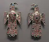 The Eagle-shaped fibulae of Alovera; 5th century; gold, bronze and glass (imitation of garnet); height: 11.8 centimetres (4.6&nbsp;in), width: 5.9 centimetres (2.3&nbsp;in); from Guadalajara (Spain); National Archaeological Museum (Madrid, Spain)