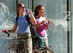 Female tourists in 2005 sporting colorful mid 2000s athletic fashions.