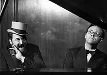 Photo of Flanders and Swann singing at the piano