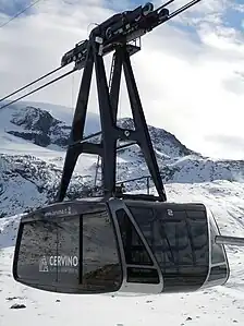 Testa Grigia aerial tramway in Cervinia, Italy, moves skiers to 3480 m glacier.