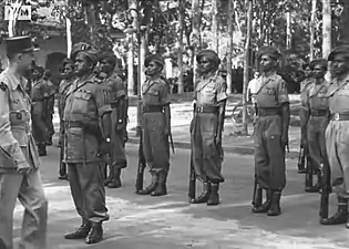General Leclerc reviews troops of 20th Division in Saigon