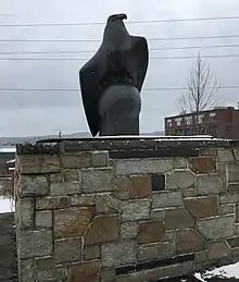 The Greendale War Memorial which consists of a sculpture of an eagle atop a globe made of granite. The memorial is located on West Boylston Street in Worcester, Massachusetts.