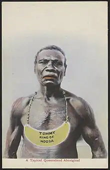 Aboriginal man wearing a breastplate inscribed King Tommy of Noosa.