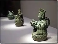 Wine ewer in the shape of a seated immortal (National Treasure No. 167)