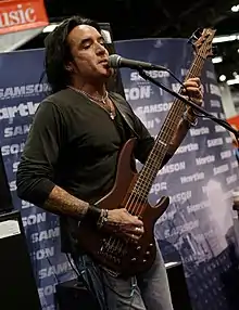 Mendoza performing in 2014