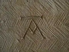 Mason's mark in the Église Saint-Honorat&nbsp;[fr] in Alyscamps, France, early 13th century