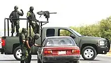 A Mexican Army Chevrolet Silverado equipped with a Mk&nbsp;19 at a military checkpoint in March 2009