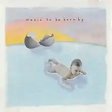 A baby, which has apparently just emerged from a large egg