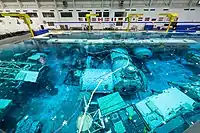 The 6.2&nbsp;million US gallons (23&nbsp;million litres) tank includes mock-ups of International Space Station modules and other training materials