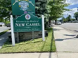 A welcome sign to New Cassel at the intersection of Union and Prospect Avenues on June 9, 2021.
