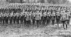 26th Battalion of the Second Canadian Expeditionary Force, 1915. The Canadian OR tunic had a vertical collar and six buttons.