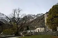 Old Church and Old Linden Tree with the east wall of Monte Rosa in the background, Macugnaga, Italy