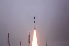 A PSLV-CA launch vehicle lifts off during daytime
