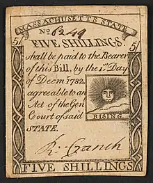 A 1779 five-shilling note issued by Massachusetts with the inscription: "FIVE SHILLINGS. shall be paid to the Bearer of this Bill, by the 1st Day of Decmr. 1782 agreeable to an Act of the Genl, Court of said STATE."; Within print of sun: "RISING".