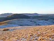 The rounded west ridge of Little Mell Fell, with Great Mell Fell beyond, and Blencathra and the Northern Fells in the distance