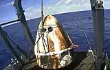 SpaceX’s Crew Dragon Demo-1 spacecraft aboard the company's recovery vessel, GO Searcher, following splashdown at 8:45&nbsp;a.m. EST on March 8, 2019.