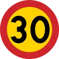 Swedish 30&nbsp;km/h speed limit – the yellow background provides a contrast in case snow covers the background against which one perceives the road sign.