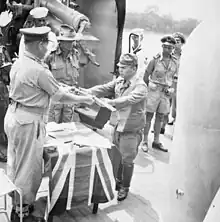 The official surrender ceremony of the Japanese to the Australian forces on board HMAS&nbsp;Kapunda at Kuching, Kingdom of Sarawak, on 11 September 1945