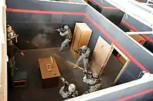 Special Forces operators from 3rd Battalion, A 10th SFG (A), conduct shoot-house training at Fort Carson in September 2009