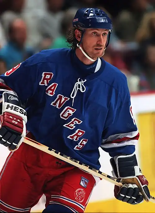 Image 11Wayne GretzkyPhoto credit: Håkan DahlströmIce hockey player Wayne Gretzky, as a member of the New York Rangers of the National Hockey League (NHL) in 1997. Gretzky, nicknamed "The Great One", is widely considered the best hockey player of all time. Upon his retirement in 1999, he held forty regular-season records, fifteen playoff records, and six All-Star records. He is the only NHL player to total over 200 points in one season—a feat he accomplished four times. In addition, he tallied over 100 points in 15 NHL seasons, 13 of them consecutively. He is the only player to have his number (99) officially retired by the NHL for all teams.More selected pictures